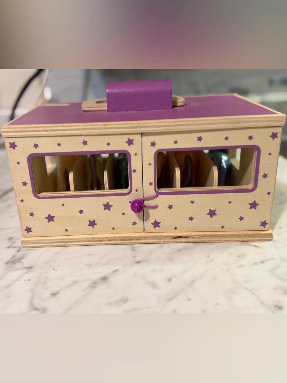 Breyer Unicorn Magic Wooden Stable Playset featuring a purple carrying case with